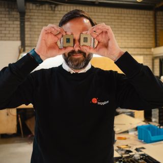 iuppiter founder holds two CPUs before he puts them in configured servers
