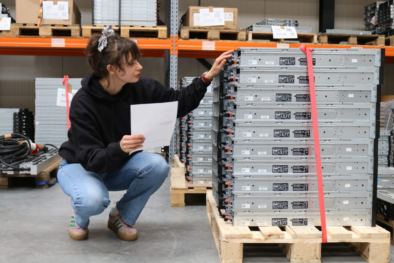 iuppiter employee inspecting used server components inside servers